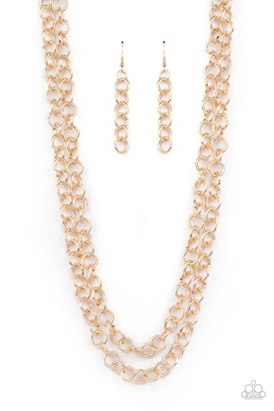 Paparazzi Accessories Grunge Goals - Gold A seemingly infinite collection of textured shiny gold links connect into two dramatic rows across the chest, creating an intense industrial display. Features an adjustable clasp closure. Sold as one individual ne