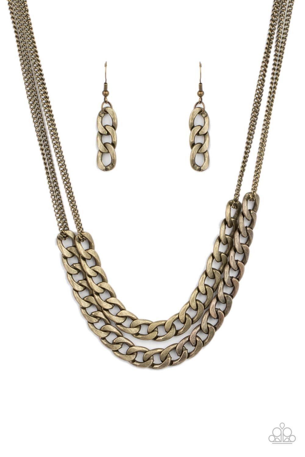 Paparazzi Accessories Urban Culture - Brass Two sections of chunky brass curb chain attach to doubled brass chains below the collar, creating an intense industrial centerpiece. Features an adjustable clasp closure. Sold as one individual necklace. Include