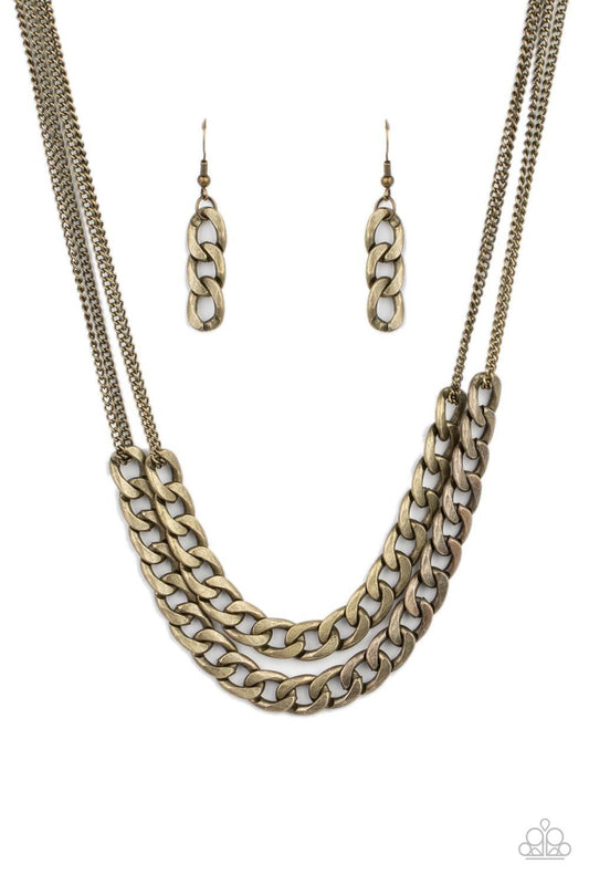 Paparazzi Accessories Urban Culture - Brass Two sections of chunky brass curb chain attach to doubled brass chains below the collar, creating an intense industrial centerpiece. Features an adjustable clasp closure. Sold as one individual necklace. Include