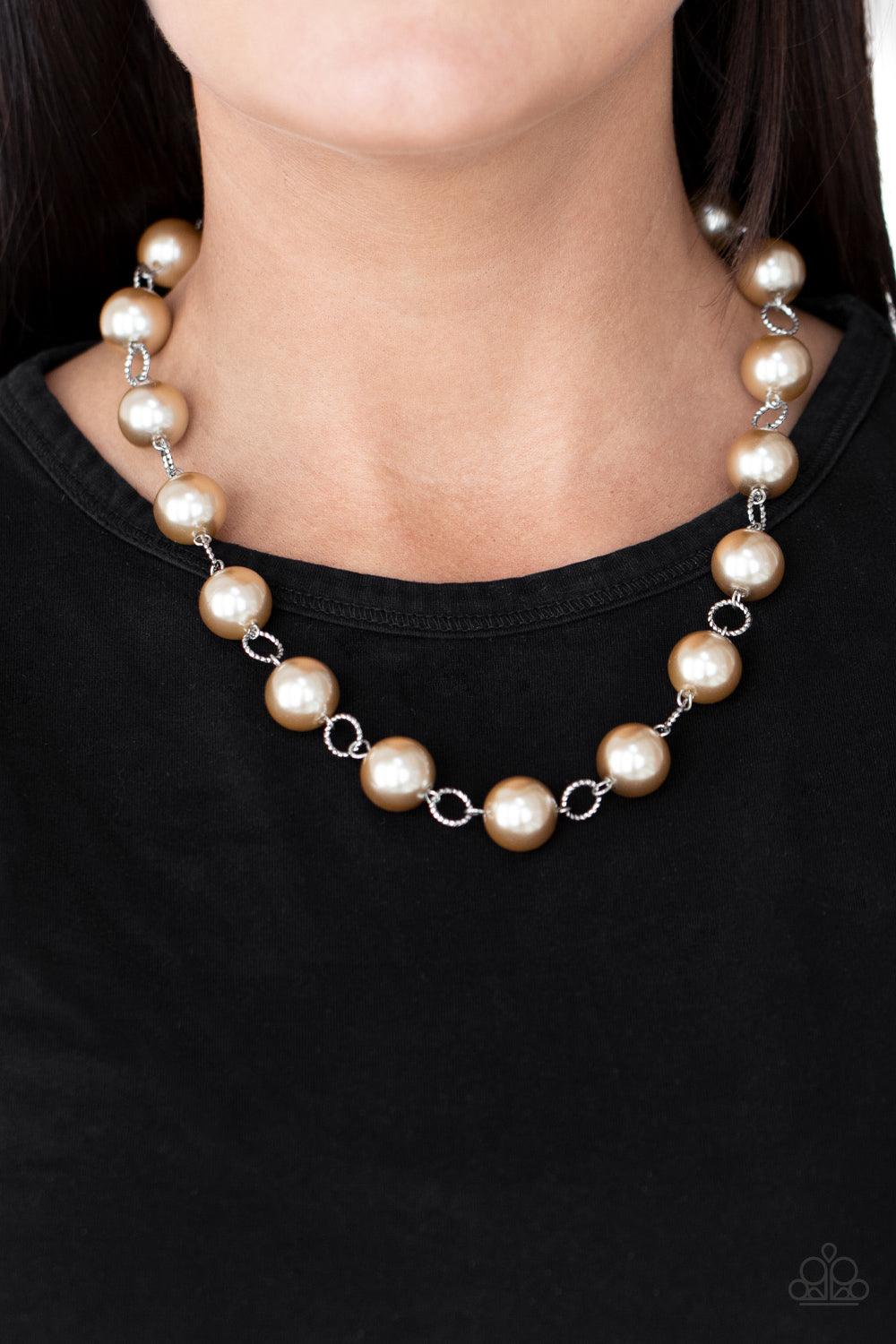 Paparazzi Accessories Ensconced in Elegance - Brown Textured silver rings and oversized brown pearls delicately link into a bubbly statement piece below the collar. Features an adjustable clasp closure. Sold as one individual necklace. Includes one pair o