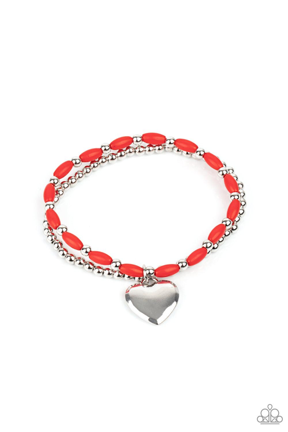 Paparazzi Accessories Candy Gram - Red A shiny silver heart dangles from a strand of fiery red beads. It is paired with a strand of round silver beads threaded along a stretchy band for a whimsical display around the wrist. Sold as one pair of bracelets.