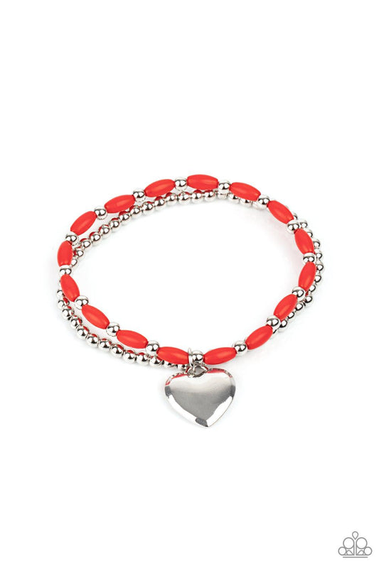 Paparazzi Accessories Candy Gram - Red A shiny silver heart dangles from a strand of fiery red beads. It is paired with a strand of round silver beads threaded along a stretchy band for a whimsical display around the wrist. Sold as one pair of bracelets.