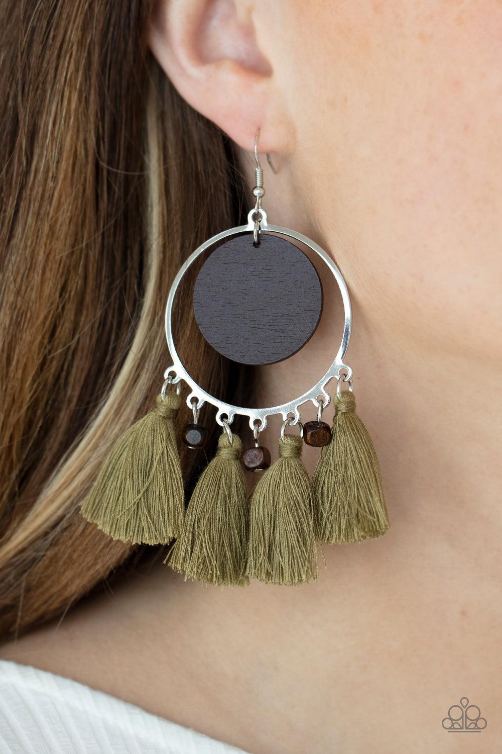 Paparazzi Accessories Yacht Bait - Green A wooden disc swings from the top of a shiny silver hoop that is adorned in dainty wooden cube beads and Willow threaded tassels, creating an earthy fringe. Earring attaches to a standard fishhook fitting. Sold as