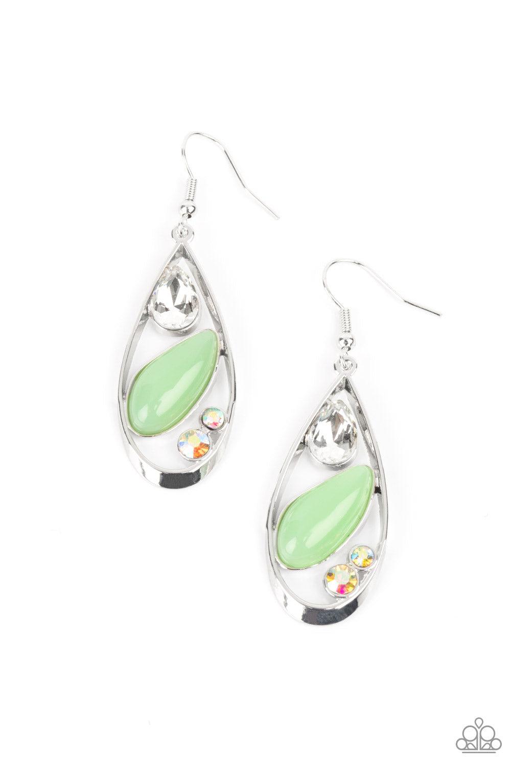 Paparazzi Accessories Harmonious Harbors - Green A silver teardrop frame embraces a collection of iridescent rhinestones and a milky Green Ash bead that is reminiscent of seashore finds. Earring attaches to a standard fishhook fitting. Sold as one pair of