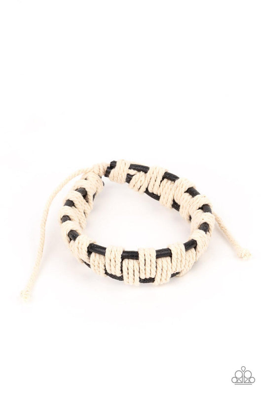 Paparazzi Accessories Rustic Terrain - Black Sections of rustic white cording interweave and knot around three rows of black leather cords, creating an earthy checkered pattern around the wrist. Features an adjustable sliding knot closure. Sold as one ind