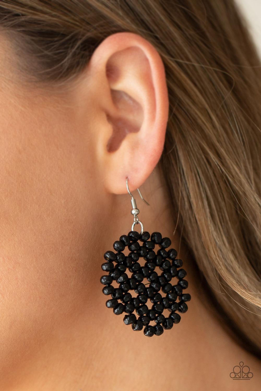 Paparazzi Accessories Summer Escapade - Black Clusters of dainty black wooden beads are threaded along invisible wire, creating a vivacious floral pattern frame for a summery flair. Earring attaches to a standard fishhook fitting. Sold as one pair of earr