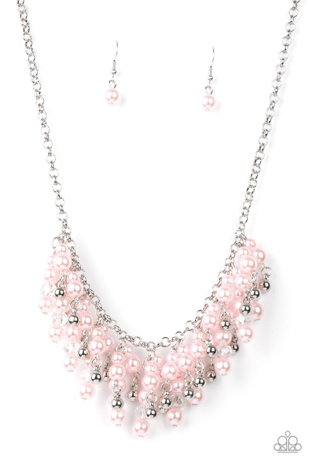 Paparazzi Accessories Champagne Dreams - Pink A bubbly collection of pink pearls, silver beads, and sparkly crystal-like beads are threaded along metallic rods that trickle from the bottom of a shimmery silver chain, creating an elegantly effervescent fri