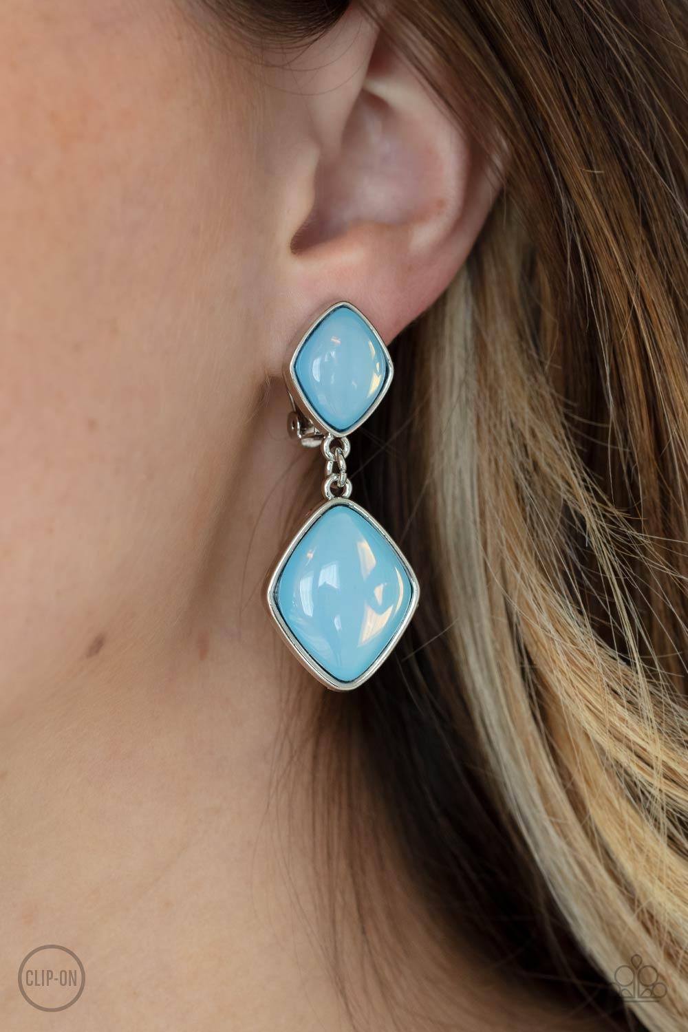 Paparazzi Accessories Double Dipping Diamonds - Blue *Clip-On A pair of diamond shaped Cerulean opals are pressed into the centers of rustic silver frames that link into an ethereal lure. Earring attaches to a standard clip-on fitting. Sold as one pair of