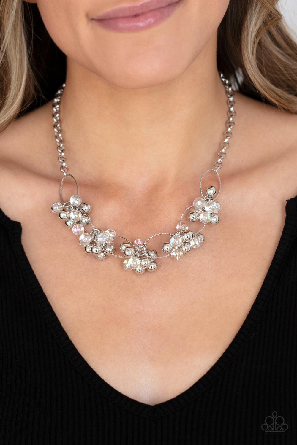 Paparazzi Accessories Effervescent Ensemble - Multi Clusters of glassy iridescent and shiny silver beads link with textured silver ovals, creating a bubbly effervescence below the collar. Features an adjustable clasp closure. Sold as one individual neckla