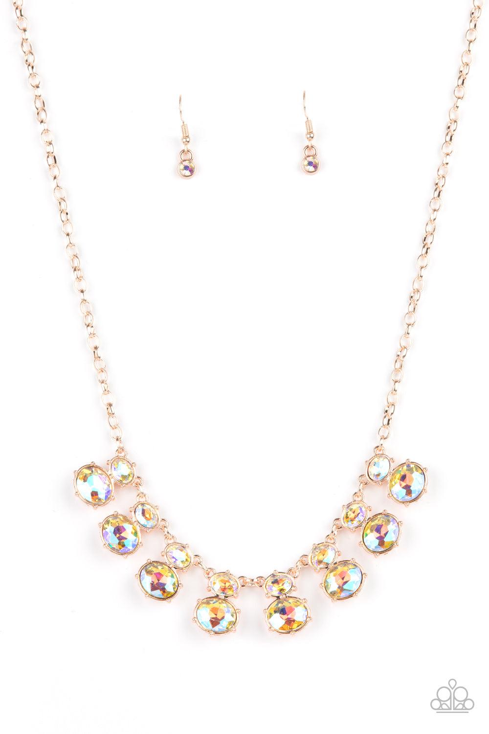 Paparazzi Accessories Cosmic Countess - Rose Gold Double stacks of iridescent oval cut gems link elegantly across the collar on a rose gold chain for a deliriously cosmic flair of glamour. Features an adjustable clasp closure. Sold as one individual neckl