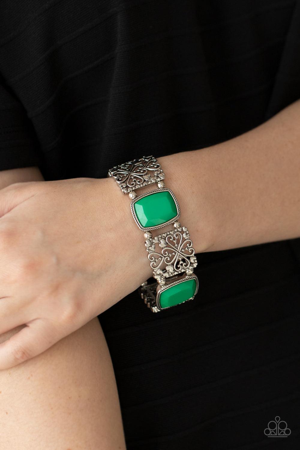 Paparazzi Accessories Colorful Coronation - Green Infused with dainty silver heart accents, whimsically filled silver filigree frames and faceted Mint beads are threaded along stretchy bands around the wrist for a colorful flair. Sold as one individual br