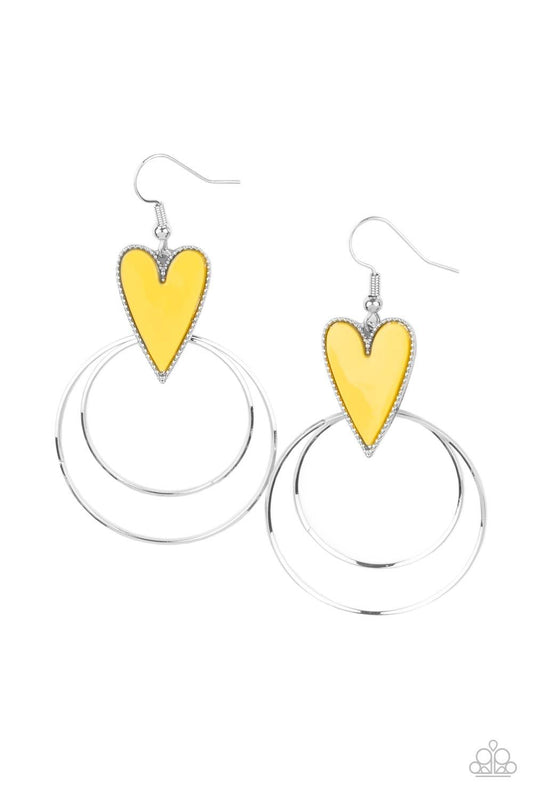 Paparazzi Accessories Happily Ever Hearts - Yellow Dainty silver hoops attach to the bottom of a playful Illuminating heart frame, creating a flirtatious pop of color. Earring attaches to a standard fishhook fitting. Sold as one pair of earrings. Jewelry