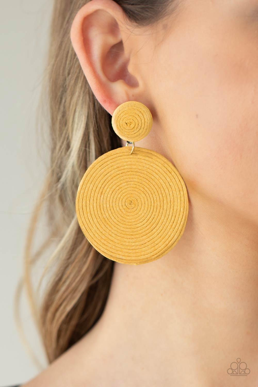 Paparazzi Accessories Circulate The Room - Yellow A generous disc of yellow thread spirals around and around for a dizzying finish as it connects to a yellow threaded button post. Earring attaches to a standard post fitting. Sold as one pair of post earri