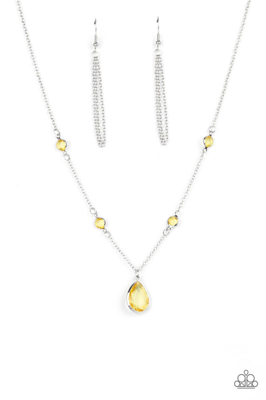 Paparazzi Accessories Romantic Rendezvous - Yellow A glassy yellow teardrop gem encased in a silver frame dips elegantly below the collar. Small round yellow gems accent the silver chain for a delicate and dreamy display. Features an adjustable clasp clos