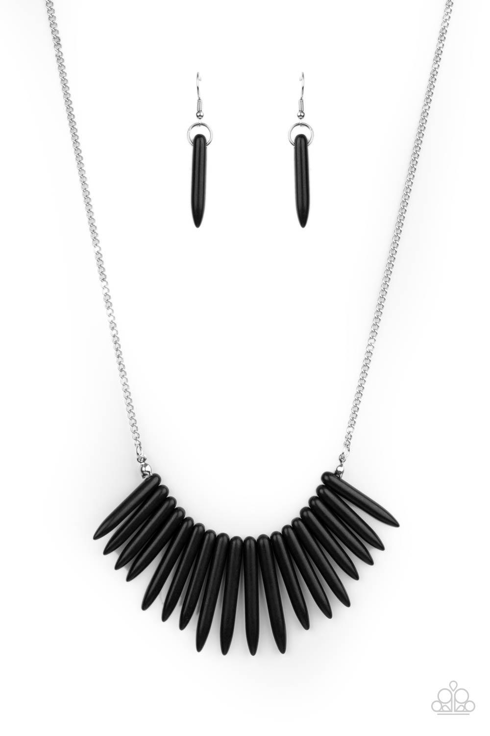 Paparazzi Accessories Exotic Edge - Black A daring fringe of black stone spikes in gradually decreasing sizes flares out below the collar for an exotic and edgy effect. Features an adjustable clasp closure. Sold as one individual necklace. Includes one pa