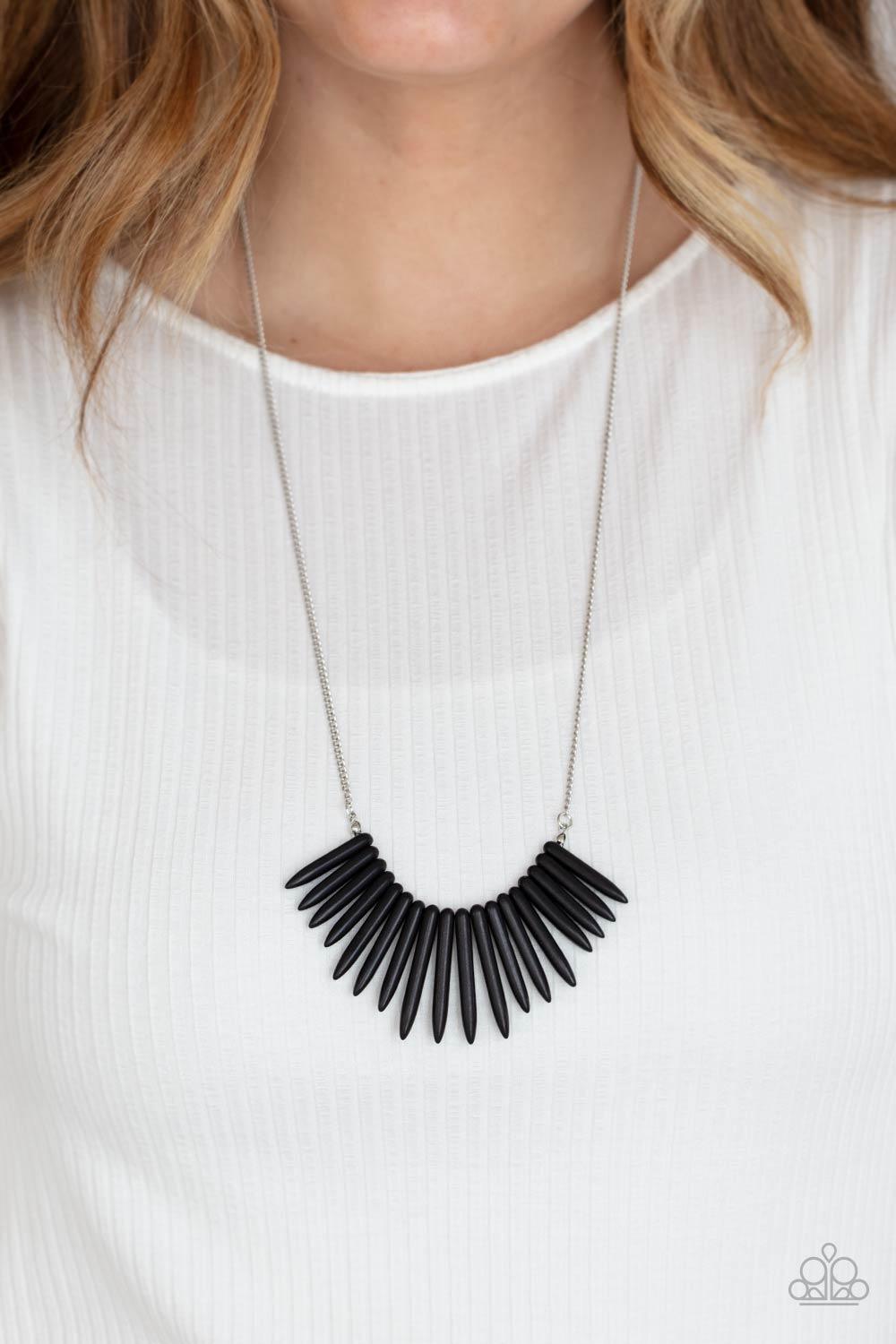 Paparazzi Accessories Exotic Edge - Black A daring fringe of black stone spikes in gradually decreasing sizes flares out below the collar for an exotic and edgy effect. Features an adjustable clasp closure. Sold as one individual necklace. Includes one pa