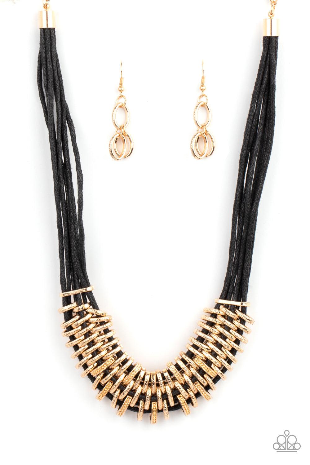 Paparazzi Accessories Lock, Stock, and SPARKLE - Gold Bold and unapologetic, this hefty necklace gives off a hand-made feel with its multiple strands of black cording held together by industrial gold fittings that shift and slide. Features an adjustable c