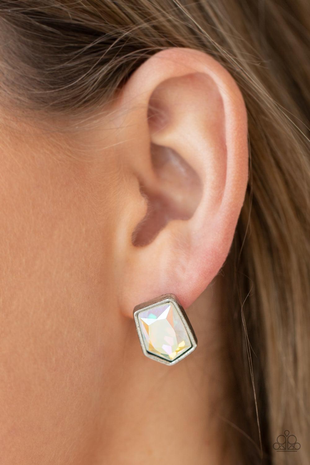 Paparazzi Accessories Indulge Me - Multi Featuring a raw asymmetrical cut, an iridescent gem is encased inside a sleek silver frame, creating a stellar display. Earring attaches to a standard post fitting. Sold as one pair of post earrings. Earrings