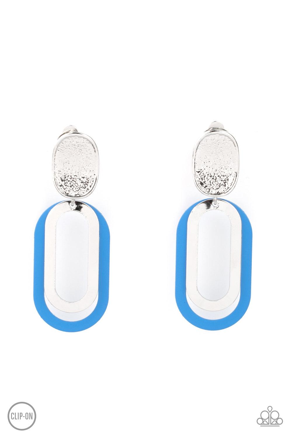 Paparazzi Accessories Melrose Mystery - Blue *Clip-On Shiny silver and French Blue oblong hoops dangle from a shimmery textured silver oval disc for an upscale finale. Earring attaches to a standard clip-on fitting. Sold as one pair of clip-on earrings. J