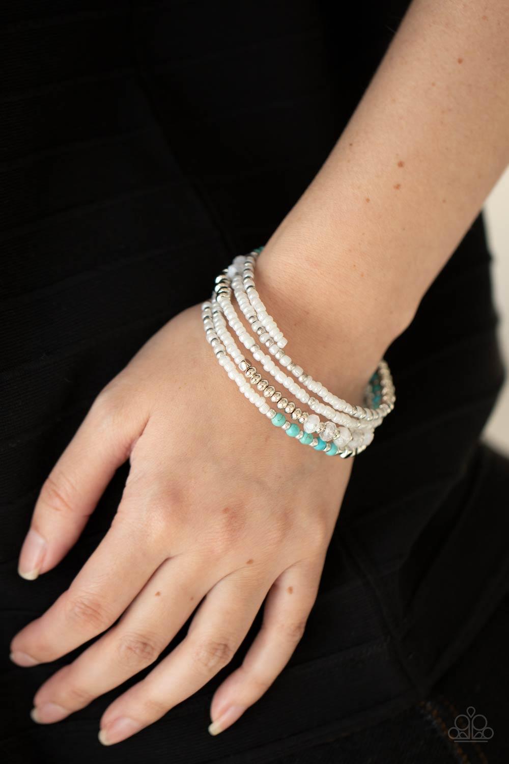 Paparazzi Accessories Infinitely Dreamy - White Sections of iridescent white seed beads alternate with silver, turquoise, and cloudy acrylic beads in infinite rows. The dreamy colors are threaded along a continuous strand of wire for an infinity wrap-styl