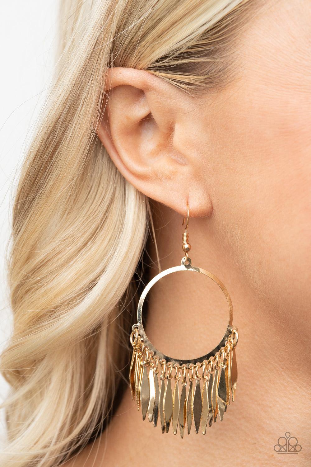 Paparazzi Accessories Radiant Chimes - Gold Flared flat bars stream out from the bottom of a glistening gold hoop, creating a radiant fringe. Earring attaches to a standard fishhook fitting. Sold as one pair of earrings. Jewelry