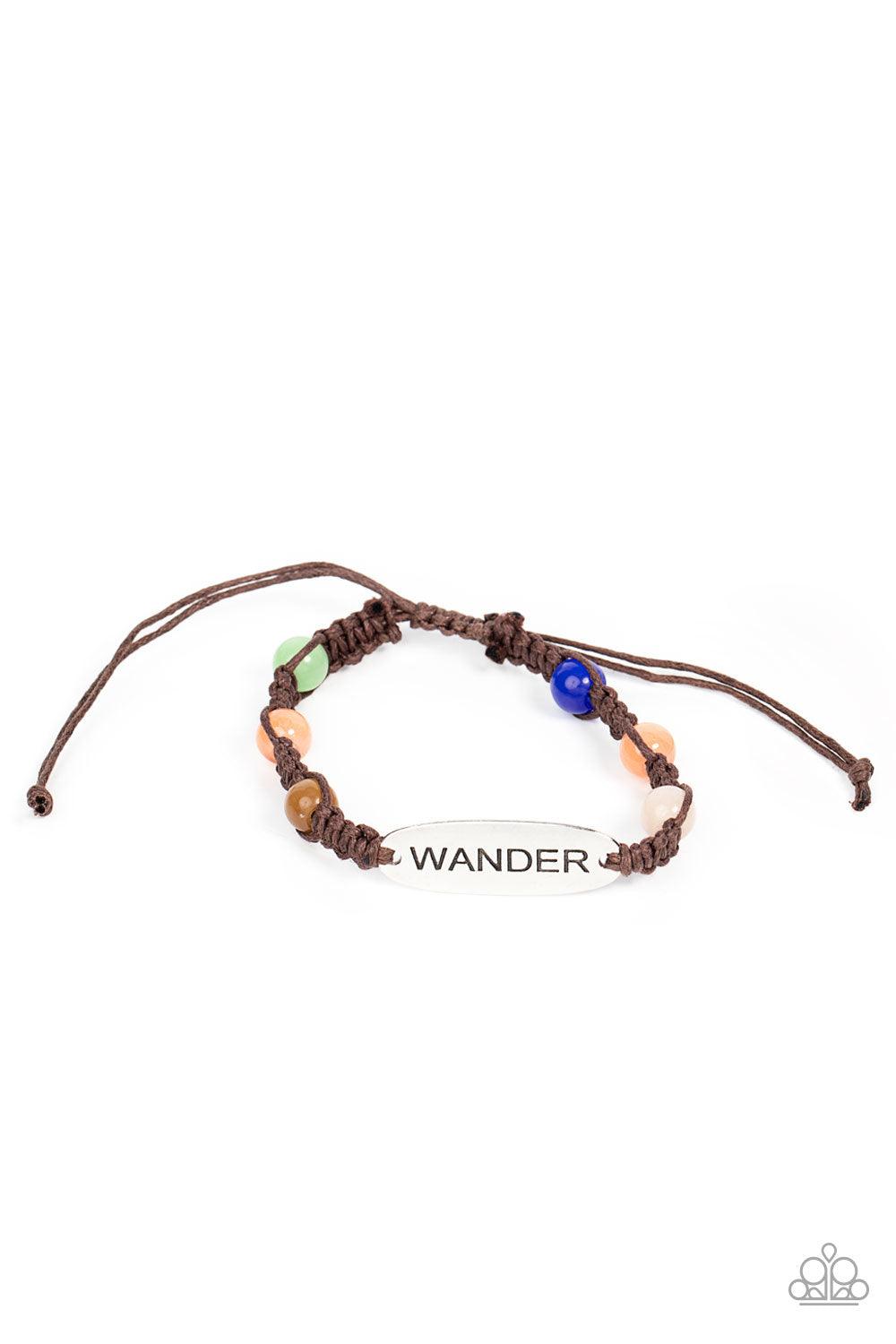 Paparazzi Accessories Roaming For Days - Multi Glassy multicolored cat's eye stone beads are knotted in place along a strand of braided brown cording that attaches to a silver centerpiece stamped in the word, "Wander," for a free-spirited fashion. Feature