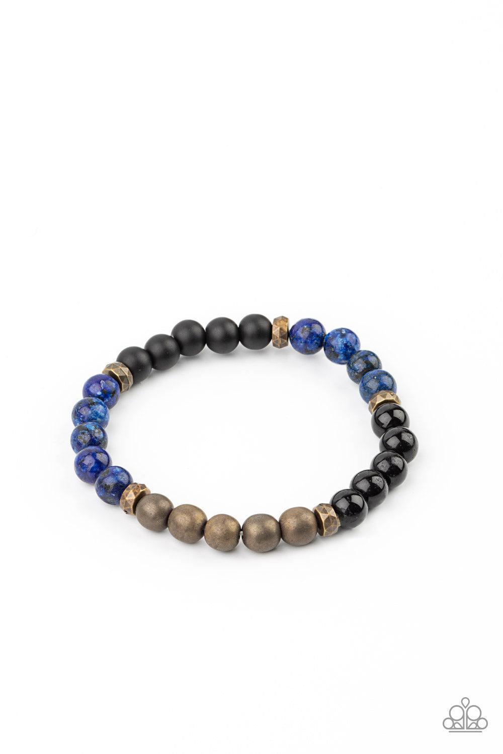 Paparazzi Accessories Petrified Powerhouse - Blue A collection of smooth round Lapiz and polished stones, punctuated by faceted antiqued brass beads, are threaded along a stretchy band and wrap around the wrist for an elementally earthy effect. Sold as on