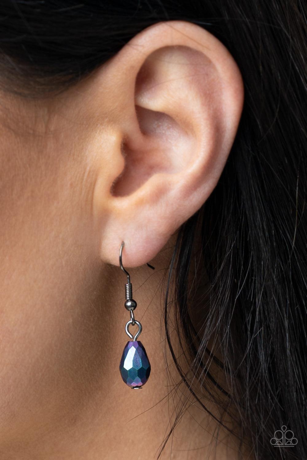 Paparazzi Accessories Teasable Teardrops - Multi An oversized scalloped teardrop frame, tipped on its point, encases rows of sparkling hematite rhinestones in its glimmery gunmetal fittings. Iridescent oil spill faceted teardrop beads dangle daintily from