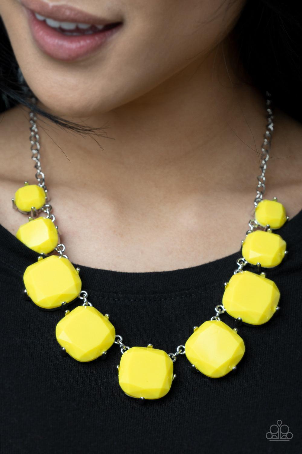Paparazzi Accessories Prismatic Prima Donna - Yellow Encased in pronged silver fittings, faceted Illuminating beads gradually increase in size as they link below the collar, creating a flamboyant pop of color. Features an adjustable clasp closure. Sold as