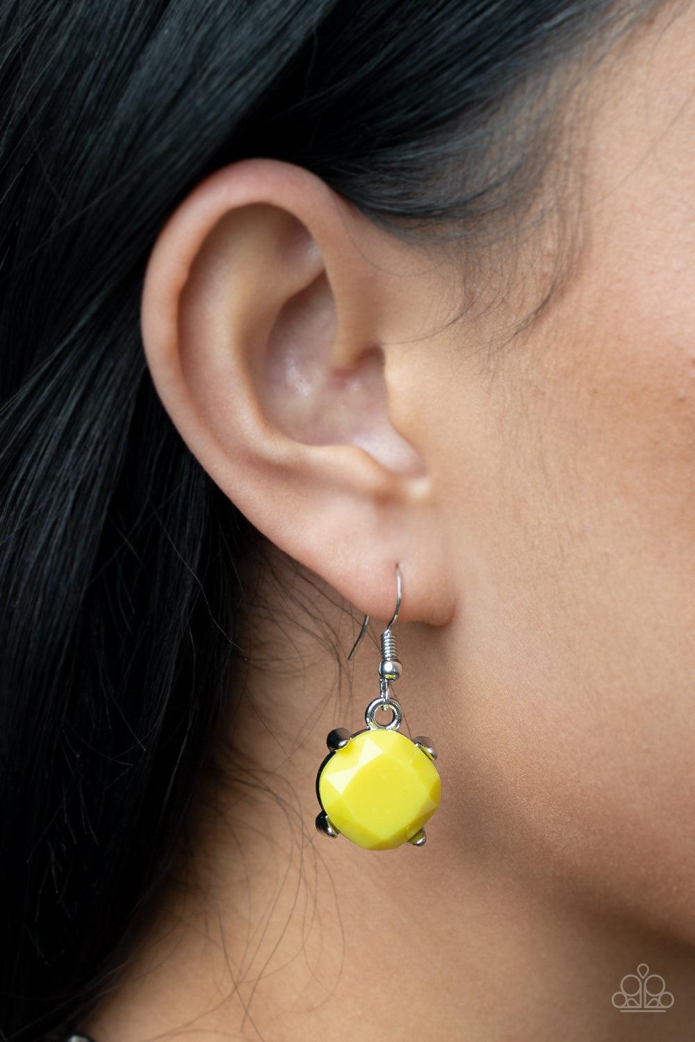Paparazzi Accessories Prismatic Prima Donna - Yellow Encased in pronged silver fittings, faceted Illuminating beads gradually increase in size as they link below the collar, creating a flamboyant pop of color. Features an adjustable clasp closure. Sold as