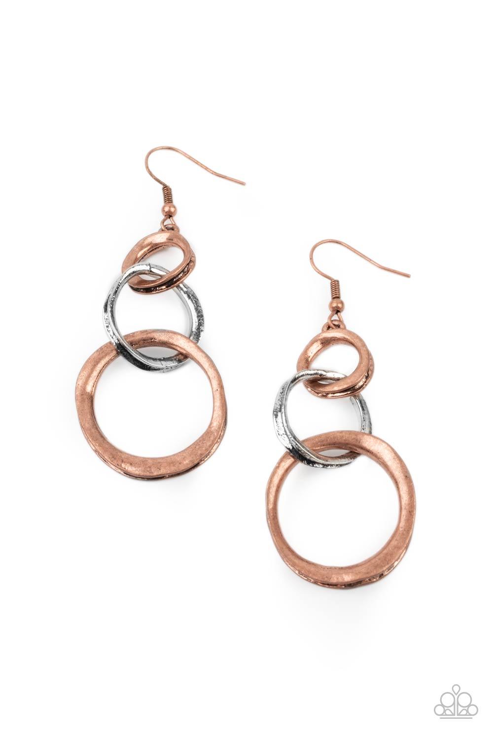 Paparazzi Accessories Harmoniously Handcrafted - Copper Featuring an antiqued beveled center, warped copper and silver rings asymmetrically connect into a rustic lure. Earring attaches to a standard fishhook fitting. Sold as one pair of earrings. Jewelry