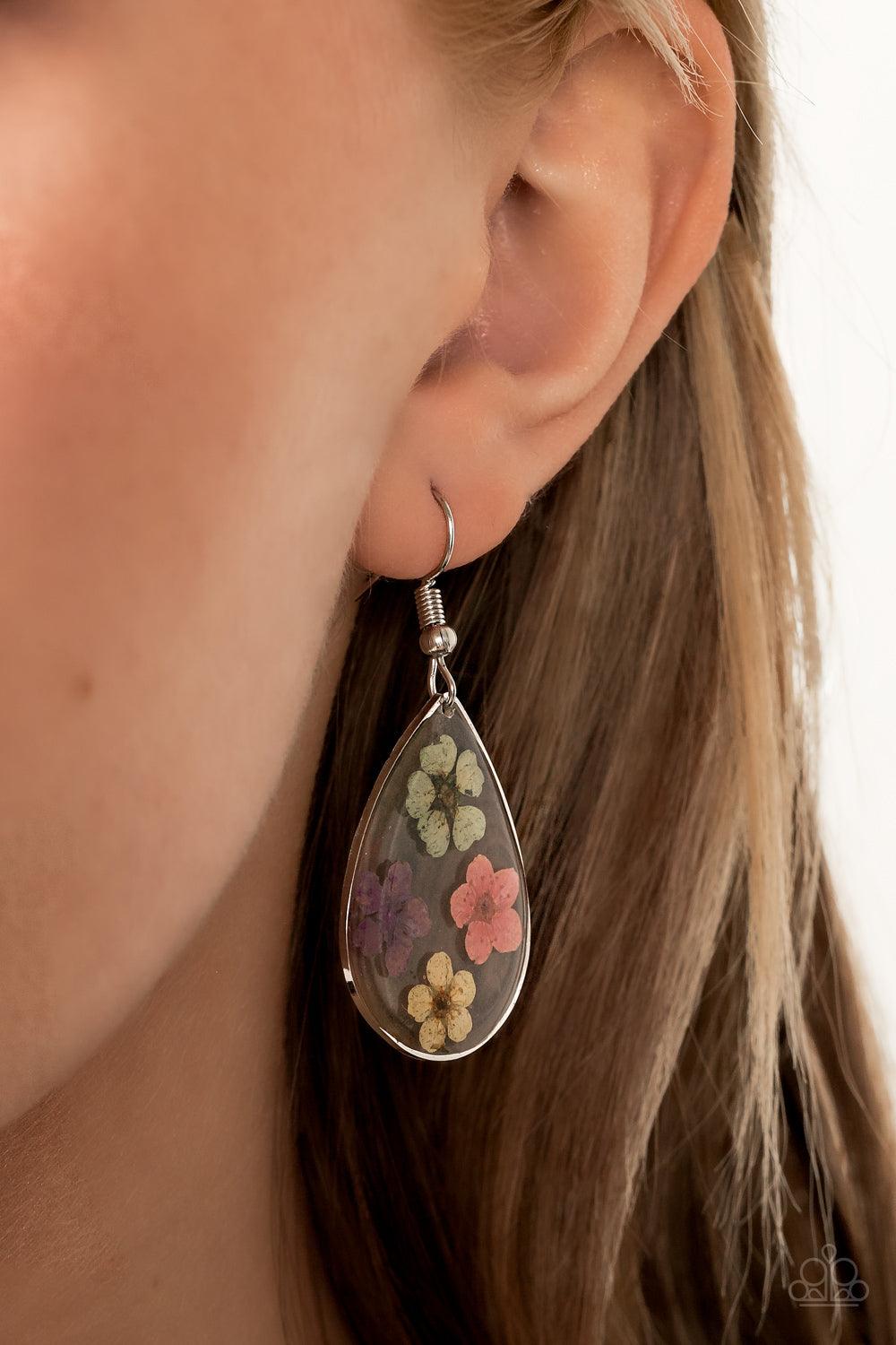 Paparazzi Accessories Perennial Prairie - Multi Dainty green, pink, purple, and yellow flowers are encased in a glassy teardrop, creating a whimsical frame. Earring attaches to a standard fishhook fitting. Sold as one pair of earrings. Jewelry