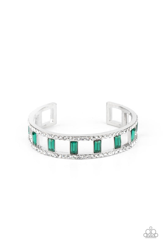 Paparazzi Accessories Industrial Icing - Green Bands of glittery white rhinestones overlaid on silver frames create an airy channel-like framework. Elegant baguette style cut green gems, connected to the glittery framework, circle around the wrist for a r