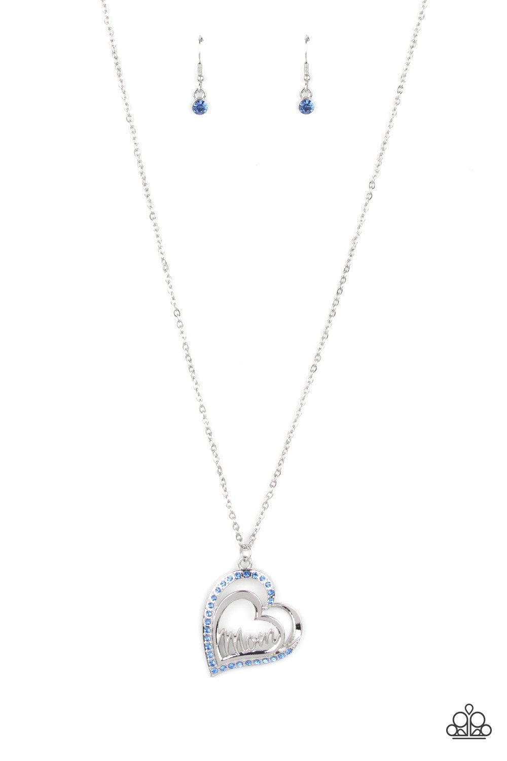 Paparazzi Accessories A Mothers Heart - Blue The word "Mom" floats inside an airy heart-shaped frame. A second heart encrusted with dewy blue rhinestones encircles the centerpiece as it sways from a lengthened silver chain for a sweet token of love. Featu