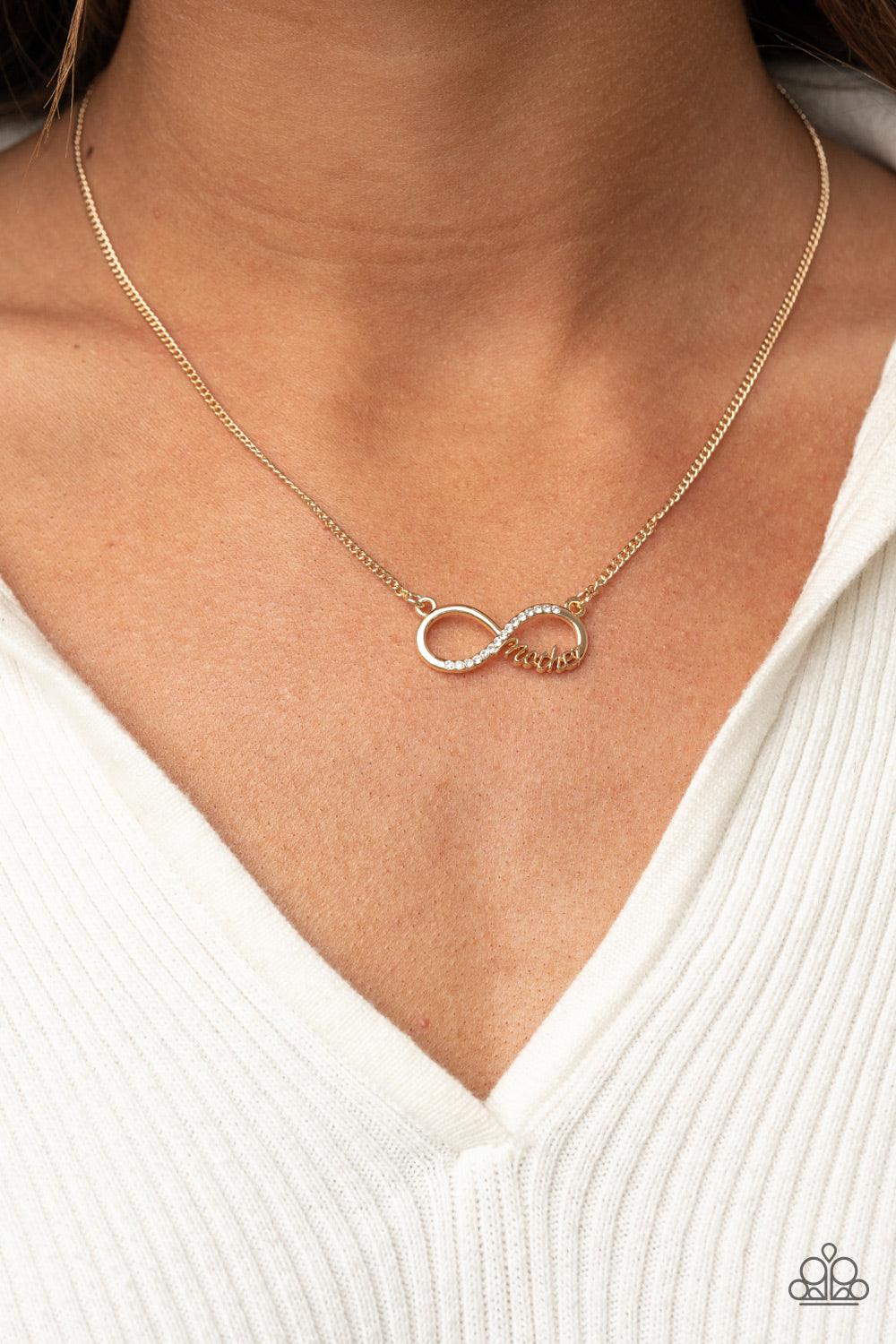 Paparazzi Accessories Forever Your Mom - Gold A bright gold infinity symbol features the word "Mother" in filigree script across the bottom. A row of sparkly dainty rhinestones travels across the curve creating a lovingly charming sentiment as it connects