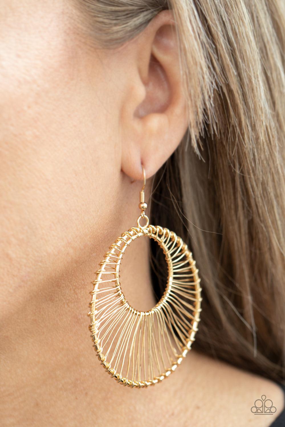 Paparazzi Accessories Artisan Applique - Gold Glistening gold wire wraps around two gold hoops, creating an airy crescent shaped frame for an artisan inspired fashion. Earring attaches to a standard fishhook fitting. Sold as one pair of earrings. Jewelry