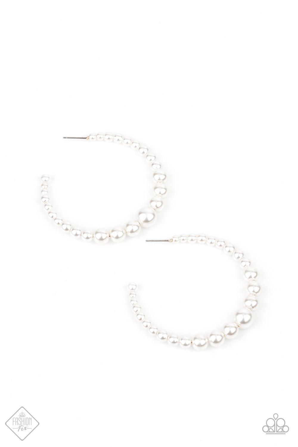 Paparazzi Accessories Glamour Graduate - White Gradually increasing in size at the center, a classy row of white pearls are threaded along an oversized hoop for a posh finish. Earring attaches to a standard post fitting. Hoop measures approximately 2 1/4"