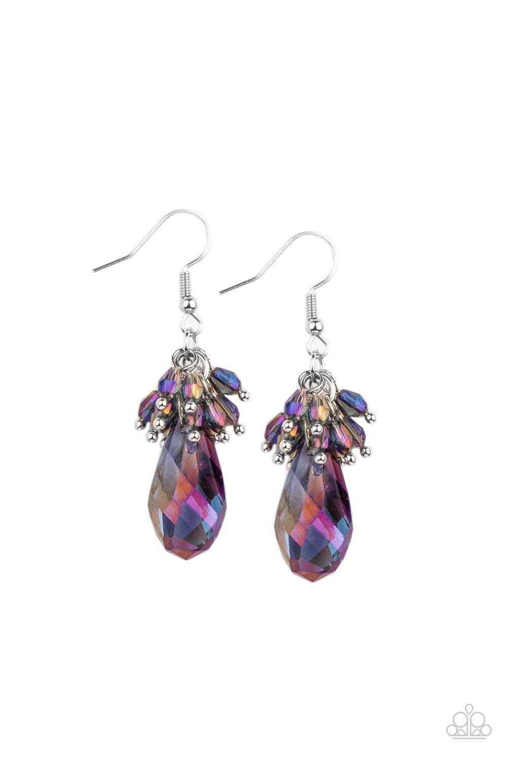 Paparazzi Accessories Well Versed in Sparkle - Purple A cluster of dainty oil spill iridescent beads delicately overlap atop an oversized smoky purple iridescent teardrop gem, creating a sparkly chandelier. Earring attaches to a standard fishhook fitting.