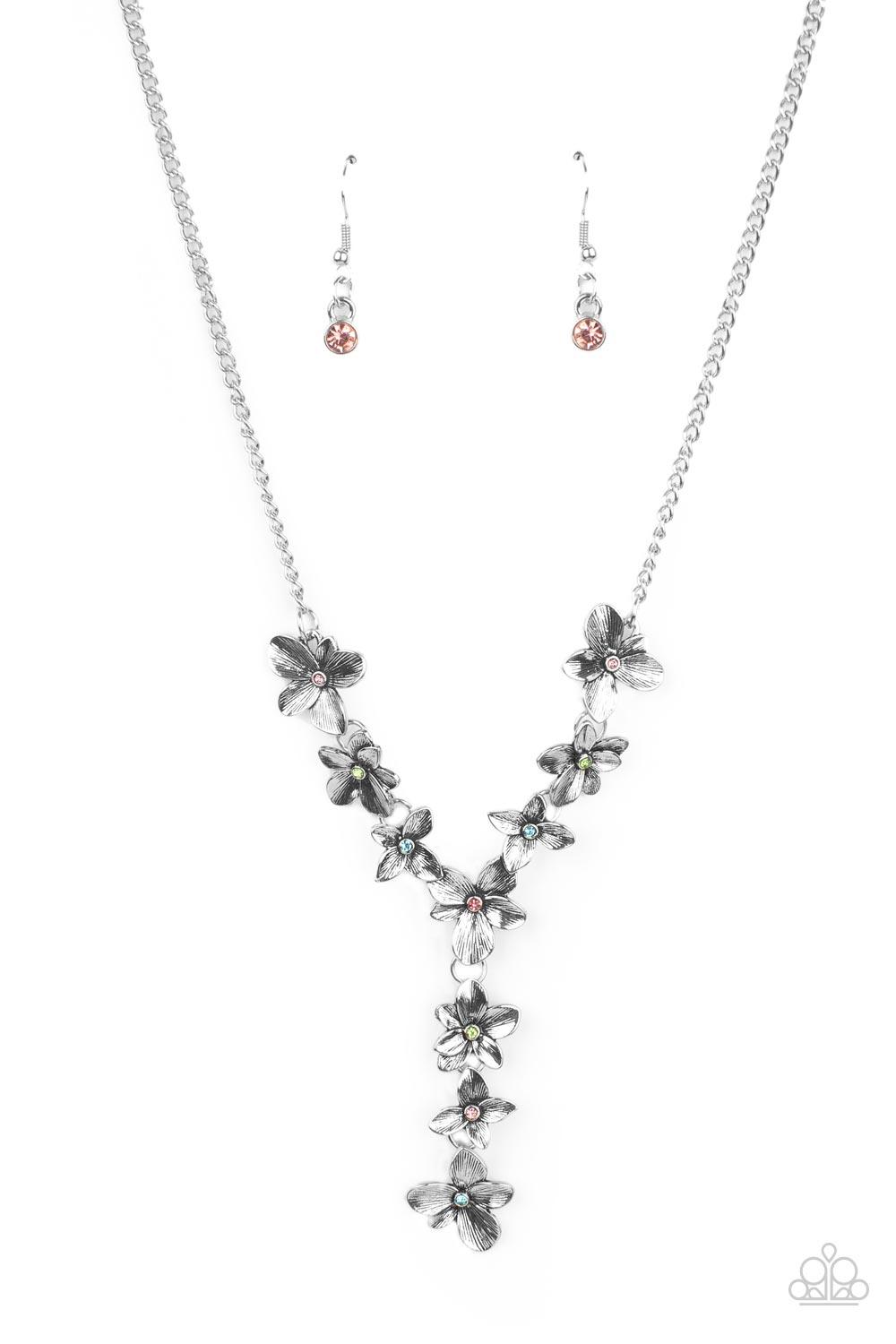 Paparazzi Accessories Fairytale Meadow - Multi Dotted with dainty multicolored rhinestone centers, whimsical silver flowers delicately link into an extended pendant below the collar for an ethereal fashion. Features an adjustable clasp closure. Sold as on