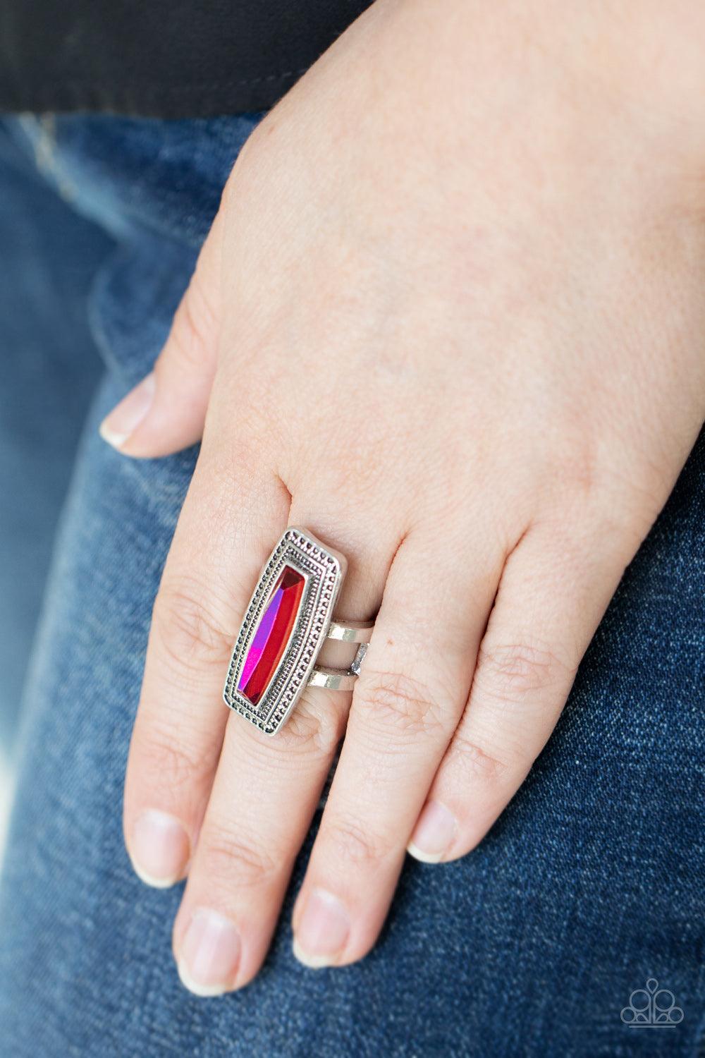 Paparazzi Accessories Luminary Luster - Multi An elongated UV gem is pressed into the center of a studded silver frame atop layered silver bands, creating a stellar centerpiece atop the finger. Features a stretchy band for a flexible fit. Sold as one indi