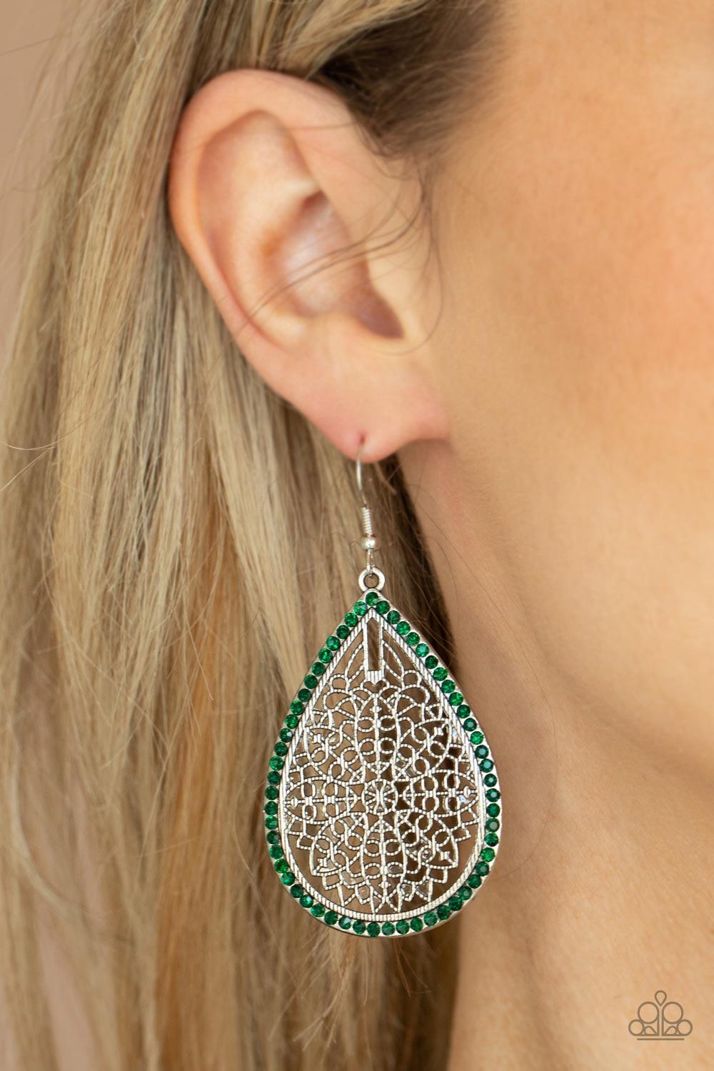 Paparazzi Accessories Fleur de Fantasy - Green Bordered in dainty green rhinestones, the center of an oversized silver teardrop is filled with an airy floral pattern for a seasonal flair. Earring attaches to a standard fishhook fitting. Sold as one pair o
