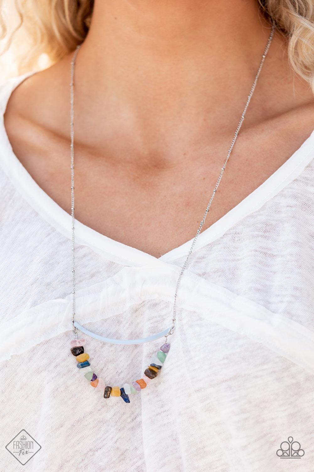 Paparazzi Accessories Pebble Prana A row of raw cut multicolored rocks are threaded along a dainty wire that bows at the bottom of a curved silver bar, creating an earthy pendant. The colorfully stacked frame swings from the bottom of a lengthened silver