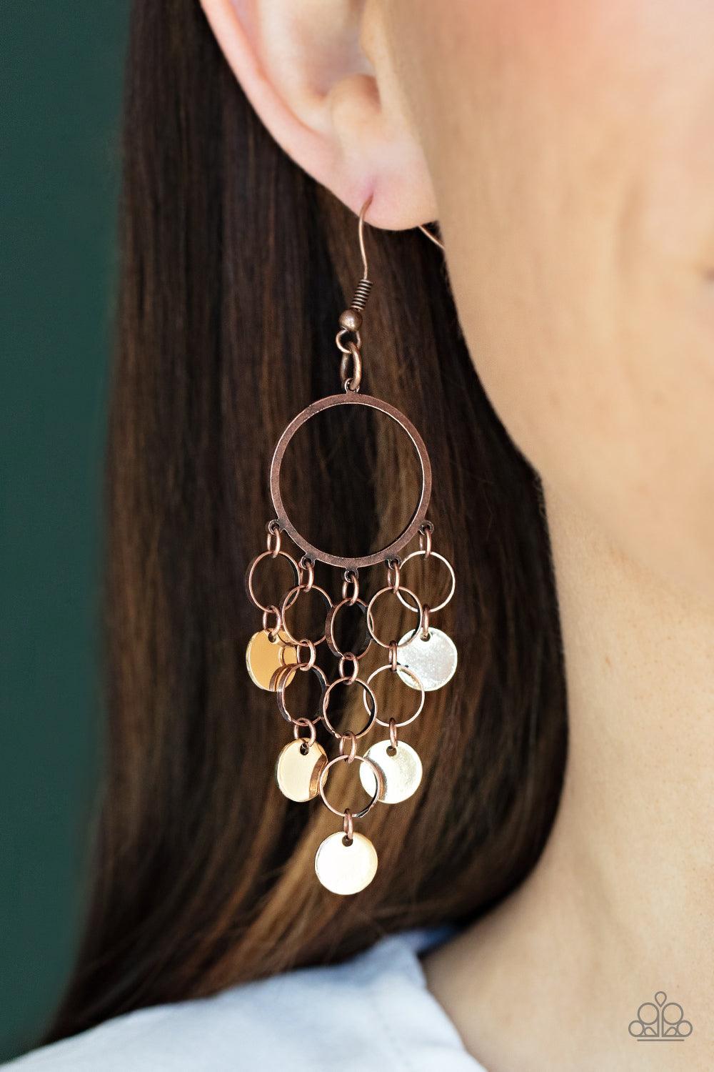 Paparazzi Accessories Cyber Chime - Multi Tapered rows of gold discs and dainty copper rings cascade from the bottom of an airy copper hoop, creating a chime-like fringe. Earring attaches to a standard fishhook fitting. Sold as one pair of earrings. Earri