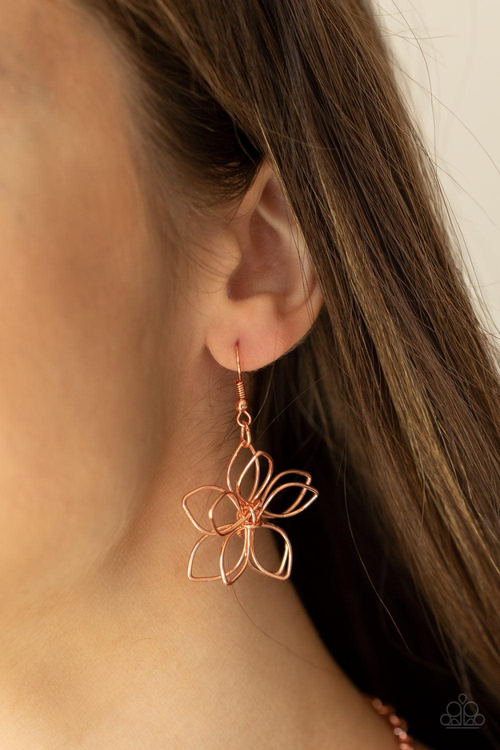 Paparazzi Accessories Flower Garden Fashionista - Copper Shiny copper wire delicately twists into oversized blossoms. Varying in size, the airy floral frames delicately link into an asymmetrical display as the layered frames elegantly pop beneath the coll