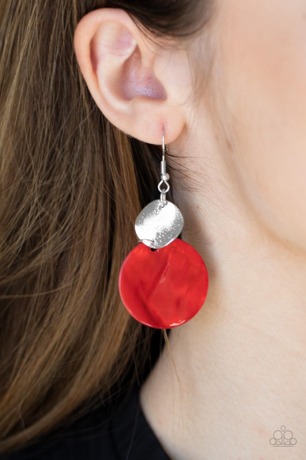 Paparazzi Accessories Opulently Oasis - Red An oversized shell-like disc is topped by a wavy, sparkling silver disc. The pair sways dramatically from a silver fitting for a breezy finish. Earring attaches to a standard fishhook fitting. Sold as one pair o
