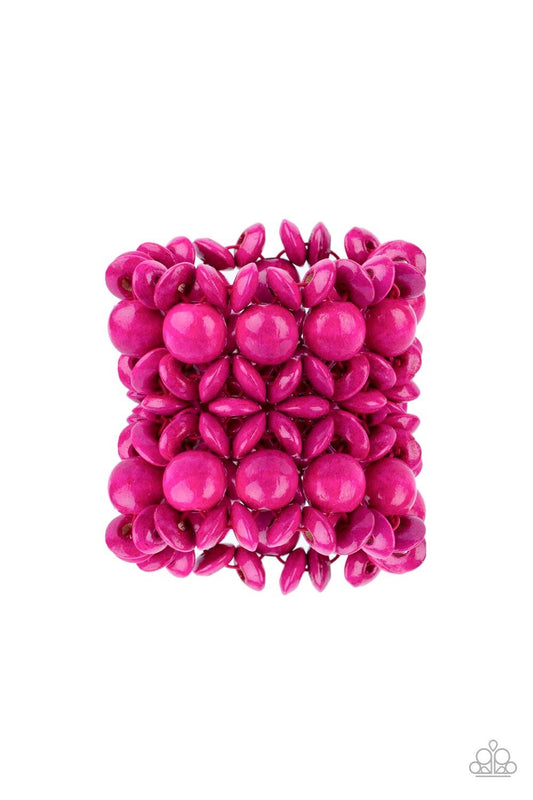 Paparazzi Accessories Island Mixer - Pink Brushed in a vibrant pink finish, an oversized collection of disc shaped and round wooden beads are threaded along ornately knotted woven stretchy bands around the wrist for a tropical inspired fashion. Sold as on