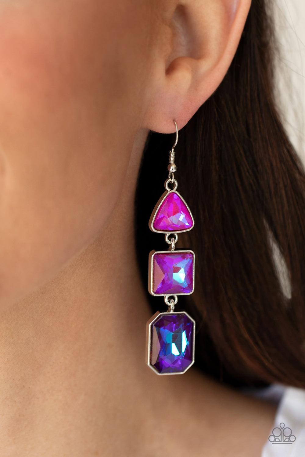 Paparazzi Accessories Cosmic Culture - Purple Featuring an iridescent UV shimmer, a trio of pink, purple, and blue geometrically shaped gems are pressed into silver frames that link together and culminate in a cosmically stellar lure. Earring attaches to