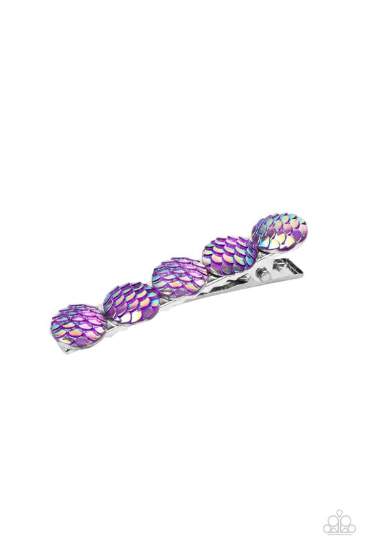 Paparazzi Accessories Mesmerizingly Mermaid - Purple Brushed in an iridescent finish, a row of purple scale-like beads adorn the front of a rectangular silver frame for a Mer-mazing finish. Features a standard hair clip on the back. Sold as one individual