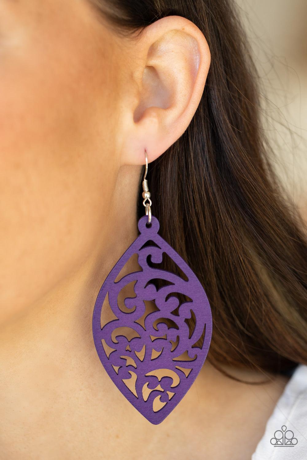 Paparazzi Accessories Coral Garden - Purple Painted in a vibrant purple finish, a floral motif permeates an airy oval wooden frame creating a tropical-inspired lure. Earring attaches to a standard fishhook fitting. Sold as one pair of earrings. Jewelry