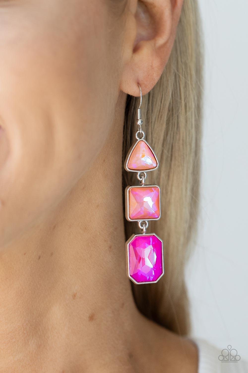 Paparazzi Accessories Cosmic Culture - Pink Featuring a UV shimmer, a trio of geometrically shaped gems, graduating in color from light to dark, are pressed into silver frames and link together culminating in a cosmically stellar lure. Earring attaches to